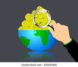 Hands of a businessman using a magnifying glass to make money on the planet.