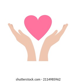 Hands carefully hold the heart. The concept of mercy, charity, kindness and love