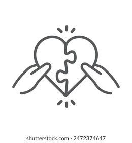 Hands carrying puzzles in the shape of love.