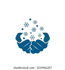 hands catching snow in winter
