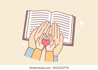 Hands of child and mother over bible with christian prayers, as metaphor for religious education for children. Caring parent reads bible with son and holds heart symbolizing kindness.