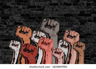 Hands with a clenched fistss raised up. Symbols of protest. Black Lives Matter. Strong fists against a brick wall.