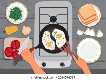Hands cooking scrambled eggs in a frying pan. On the table are: tomato, onion, pepper, eggshell, herbs, bread and plates. Top view. The concept of cooking at home. Vector Illustration, flat style
