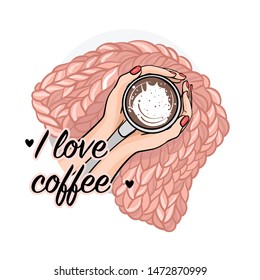 hands with a Cup of coffee on the background of a knitted blanket