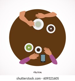 hands, cups, phone on white table. Tea party friends at a cafe