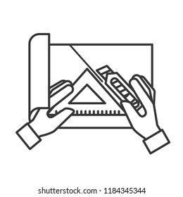 hands with cutter and triangle ruler cut paper