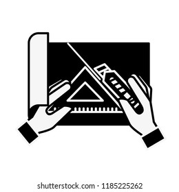 hands with cutter and triangle ruler cut paper