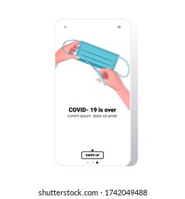 hands cutting medical mask with scissors covid-19 pandemic is over coronavirus quarantine ending concept smartphone screen mobile app copy space vector illustration