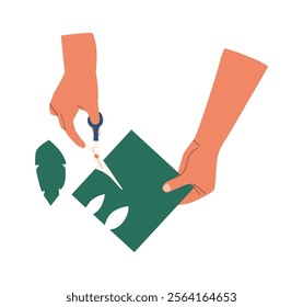 Hands cutting out of paper