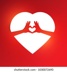 Hands do abstract heart shape on red heart on red and pink background.