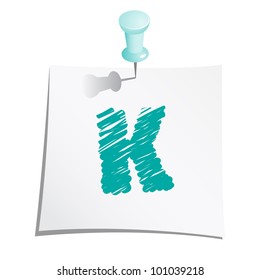 Hands draw alphabet on paper note with push pin. Letter K.