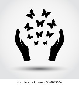 Hands and flying butterflies