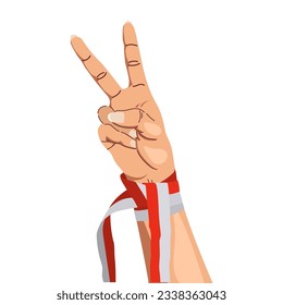 hands gesturing peace sign wearing Indonesian red and white ribbon. Indonesia's independence 17 agustus 1945