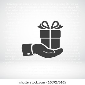 in the hands of a gift. hand and drawer vector graphics. celebration. hands. The design is stylish. work for your site. 10 eps