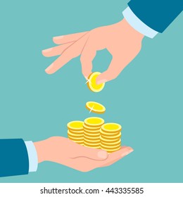 Hands with golden coins on blue background. Hand putting coins in other hand. Concept of savings, donation, paying.