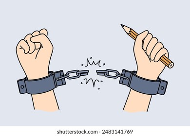 Hands of handcuffed reporter at moment of liberation, holding pencil to write honest investigative journalism. Liberation of man from shackles, as metaphor for emergence of free mass media