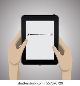 Hands hold a black tablet. Modern device on a gray background
