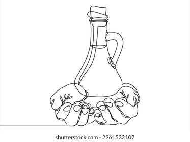 Hands hold olive oil. Male hand holding olive oil bottle on white background.