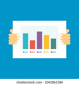 hands hold a sheet of paper with a graph on a blue background