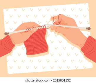 Hands holdigng knitting needles with pattern on background