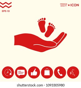 Hands holding baby foot