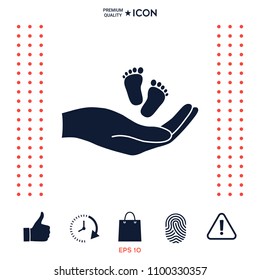 Hands holding baby foot