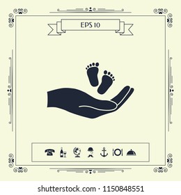 Hands holding baby foot