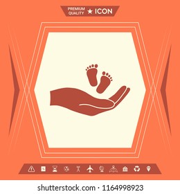 Hands holding baby foot