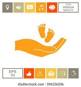 Hands holding baby foot