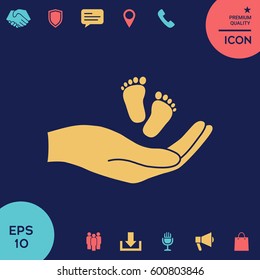 Hands holding baby foot