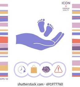 Hands holding baby foot