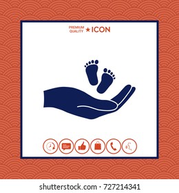 Hands holding baby foot