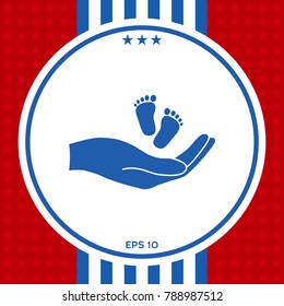 Hands holding baby foot