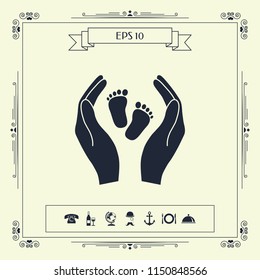 Hands holding baby foot - protection symbol