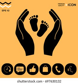 Hands holding baby foot - protection symbol
