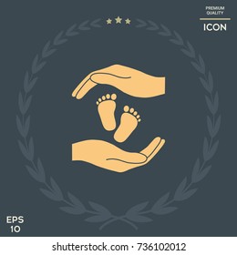 Hands holding baby foot, protection symbol