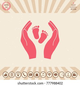 Hands holding baby foot - protection symbol