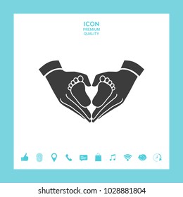 Hands holding baby - protection symbol. Heart shape made with hands