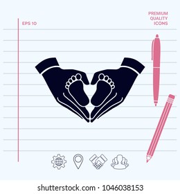 Hands holding baby - protection symbol. Heart shape made with hands