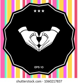 Hands holding baby - protection symbol. Heart shape made with hands