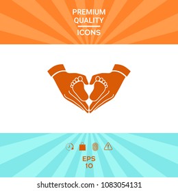 Hands holding baby - protection symbol. Heart shape made with hands