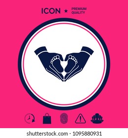 Hands holding baby - protection symbol. Heart shape made with hands