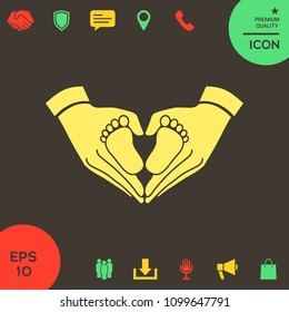 Hands holding baby - protection symbol. Heart shape made with hands