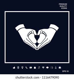 Hands holding baby - protection symbol. Heart shape made with hands