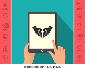 Hands holding baby - protection symbol. Heart shape made with hands