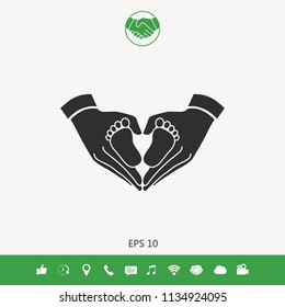 Hands holding baby - protection symbol. Heart shape made with hands