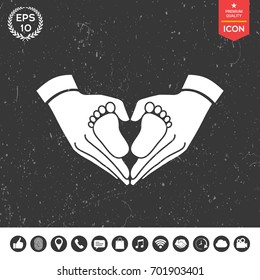 Hands holding baby - protection symbol. Heart shape made with hands