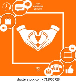 Hands holding baby - protection symbol. Heart shape made with hands