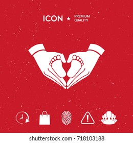 Hands holding baby - protection symbol. Heart shape made with hands