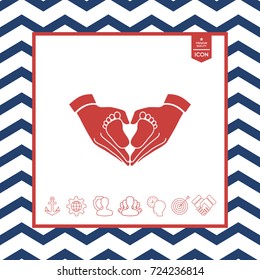 Hands holding baby - protection symbol. Heart shape made with hands